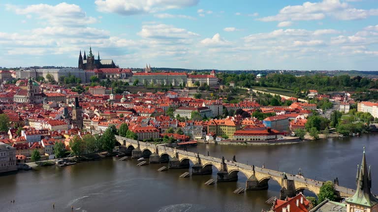 Panoramic view from above on the Prague center, aerial of the Prague city, view from above on the cityscape of Prague, flight over the city, top view, Vltava River, Charles Bridge, Prague, Czechia.