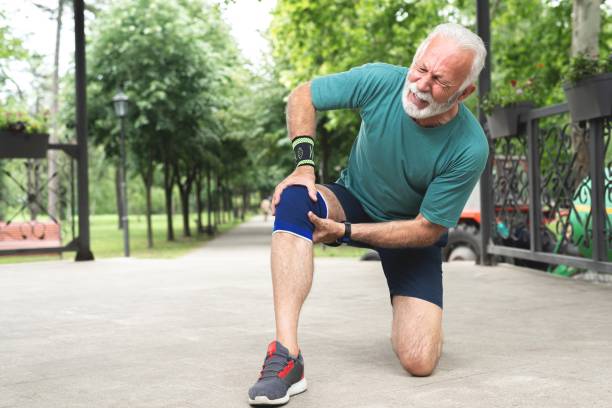 istock Senior man suffering with knee pain during workout 1261861505