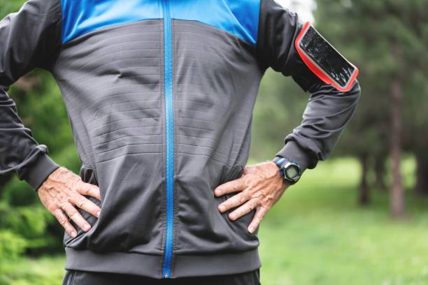 istock Midsection of sportsman taking a break while exercising at park 1261862593