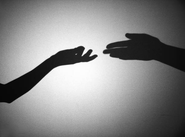 istock Mutual aid, arms shadows 1261866927