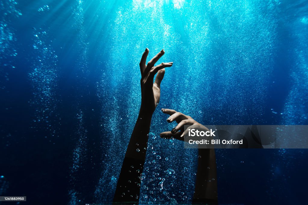 Woman drowning underwater Drowning Stock Photo