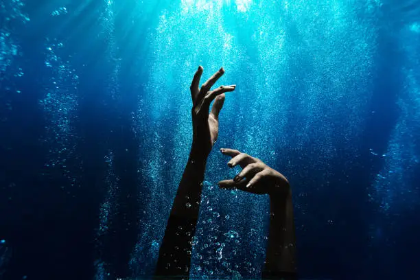 Woman drowning underwater