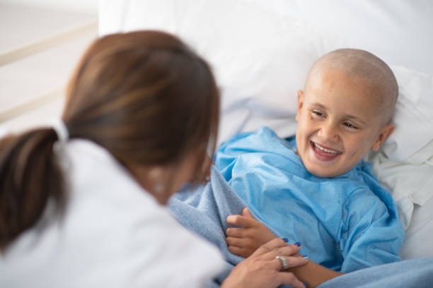 istock Doctor making cancer patient laugh 1261907346