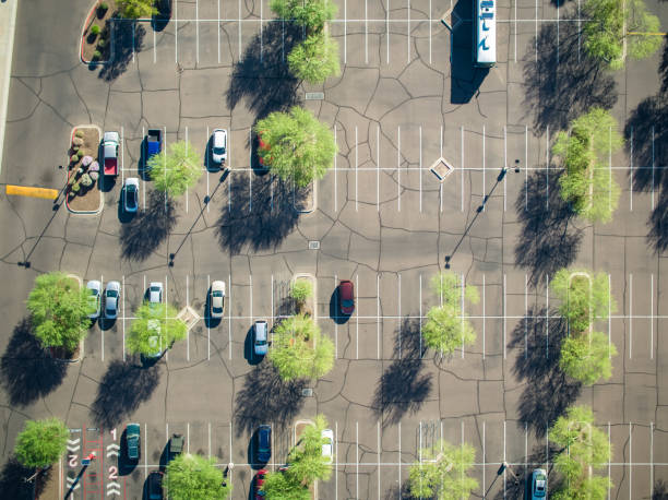 istock Top Down Drone Shot of Vast Surface Parking Lot 1261909644