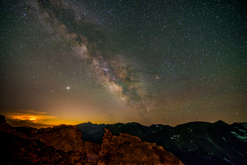 star exposure photo in dark valley located outside the city. In the dark, millions of stars and the Milky Way are visible in the sky. Taken with a full-frame camera using the long exposure technique.