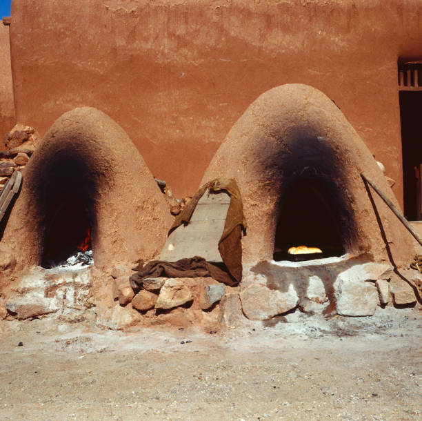 Double Horno Oven at Native American Pueblo - 61720 Two Horno Outdoor Ovens for baking bread: a mud adobe built oven still used in New Mexico and Arizona used for bread and meat stove oven adobe outdoors stock pictures, royalty-free photos & images
