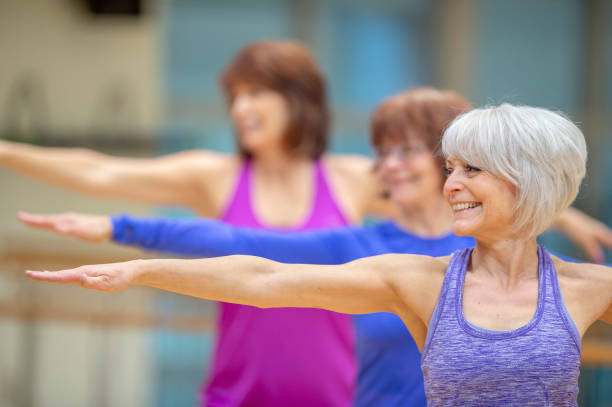 istock Group of senior women exercising together 1261982806