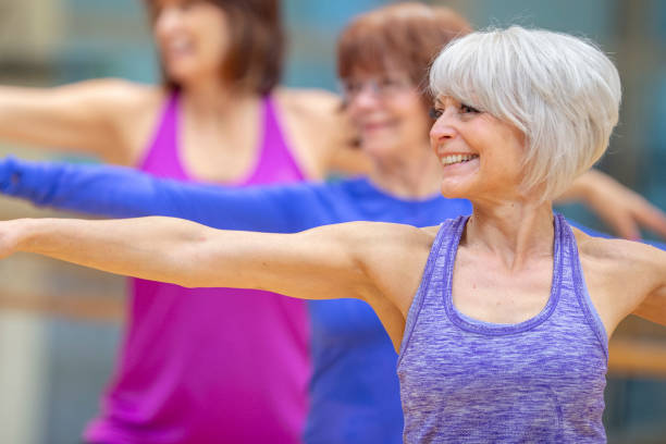 istock Group of senior women exercising together 1261982809