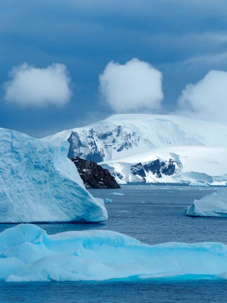 istock Puffy clouds over Antarctic seascape 1261991584