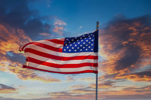 istock Flag Unfurling in Sunset 1262021429