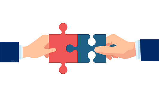 Vector of two men hands putting puzzle pieces together