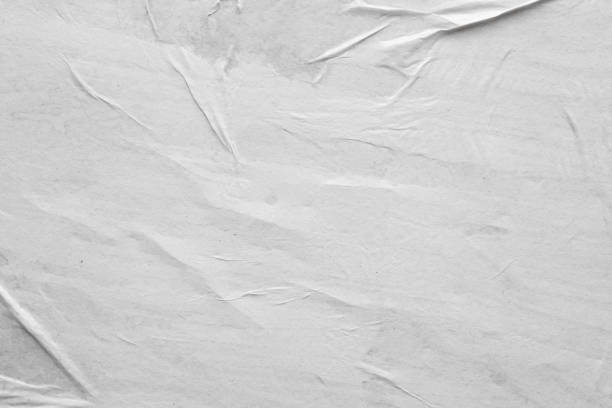 istock Blank white crumpled and creased paper poster texture background 1262025787