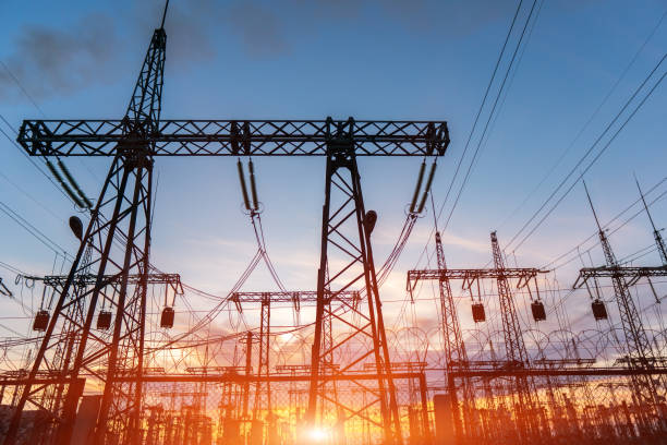 istock High-voltage power lines at sunset or sunrise. High voltage electric transmission tower 1262026037