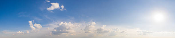 istock Wide sky panorama with scattered cumulus clouds 1262026039