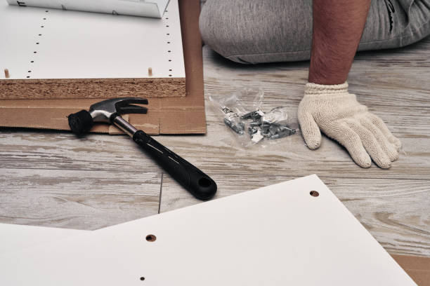 istock Furniture assembly process. Using a hammer when assembling furniture. Do it yourself. 1262026576