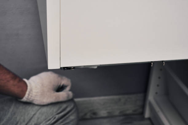 istock Furniture assembly process. The process of assembling cabinets and shelves. Do it yourself. 1262026593