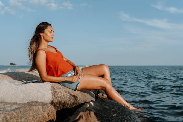 istock Woman spending a Sunday at the beach 1262031655