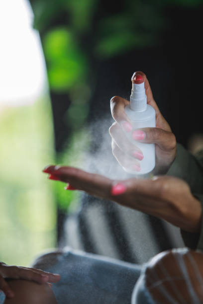 istock Woman sanitizing her hands as a preventive measure 1262036624