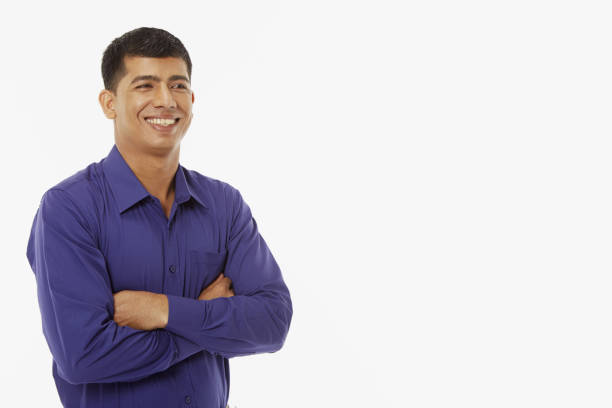 istock Man standing with arms crossed, smiling 1262043283