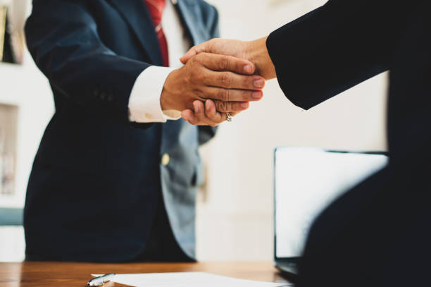 istock Handshake with business partners in the meeting. 1262044872