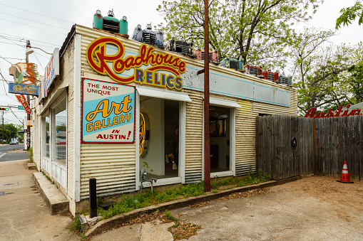 Austin, Texas USA - April 10, 2016: The Roadhouse Relics store on Congress Avenue near downtown is a popular tourist destination for its famed Austin city mural.