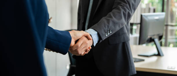 istock Business people shaking hand together. 1262086576