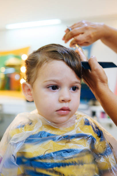 istock Boy toddler getting a haircut 1262090213
