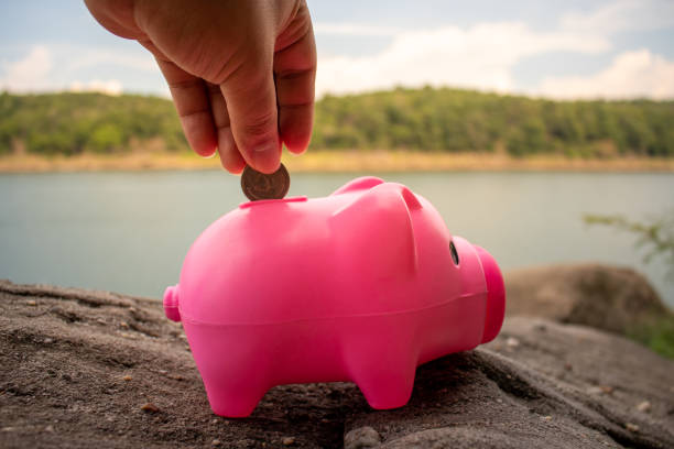 istock piggy bank on the beach 1262090299