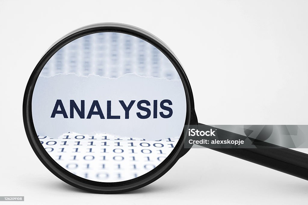 Analysis Close up of magnifying  glass on Analysis Analyzing Stock Photo