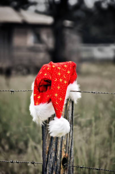 istock Santa Hat on a fence 1262092046