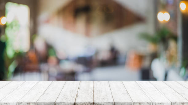 istock Empty white marble stone table top and blur glass window interior restaurant banner mock up abstract background - can used for display or montage your products. 1262099946