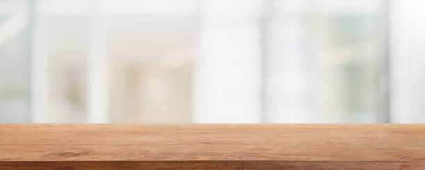istock Empty white marble stone table top and blur glass window interior restaurant banner mock up abstract background - can used for display or montage your products. 1262099958