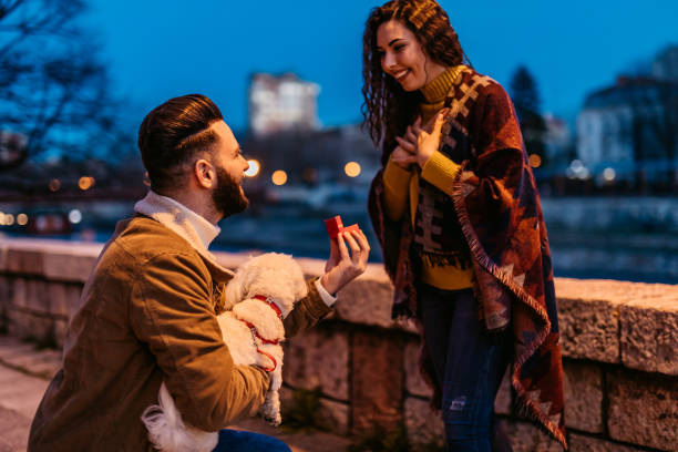 istock Young man proposing to his girlfriend 1262100105