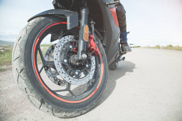 istock Motorcycle driver riding alone on asphalt motorway. 1262111730