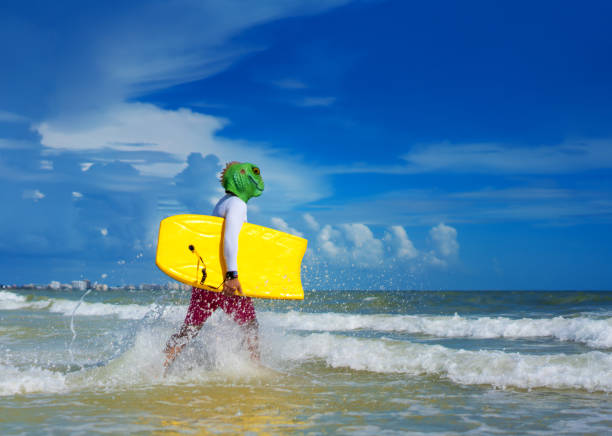 istock Wearing a lizard mask entering the beach 1262121119