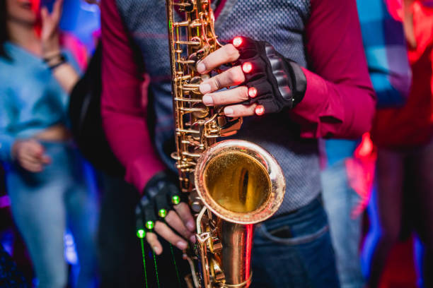 istock Saxophonist on club party 1262125350