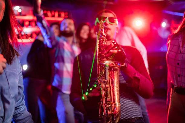 istock Saxophonist on club party 1262126574