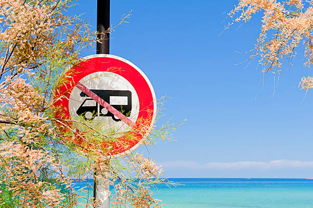 istock Camper vans prohibited sign by the sea 126212869