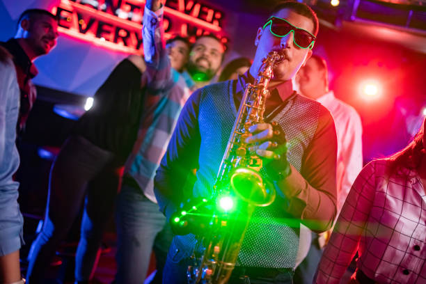 istock Saxophonist on club party 1262129311