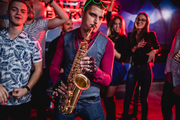 istock Saxophonist on club party 1262129845
