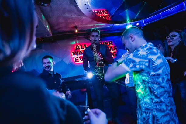istock Saxophonist on club party 1262130421