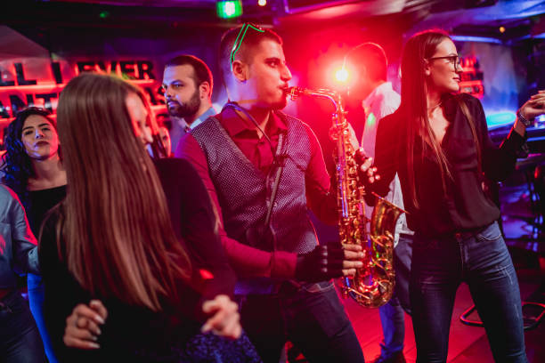 istock Saxophonist on club party 1262132001