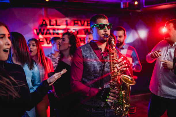 istock Saxophonist on club party 1262133657