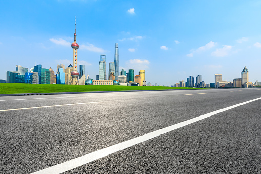 Empty asphalt road and city skyline and buildings in Shanghai,China.