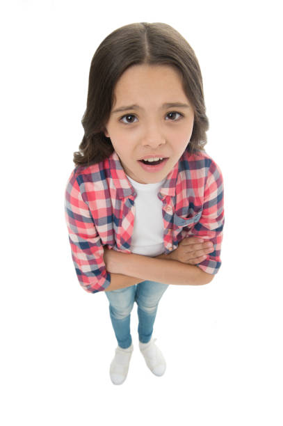 istock Do you need problems. Kid serious bully face white background. Kid unhappy looks strictly. Girl folded arms on chest looks serious. Stop bullying concept. Kids bullying behavior. What did you say 1262140246