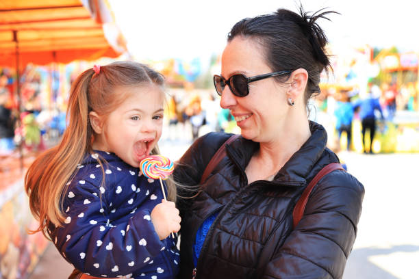 istock Mother and her kid in amusement park 1262157892