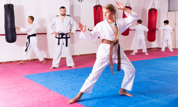 istock girl practicing taekwondo 1262160044