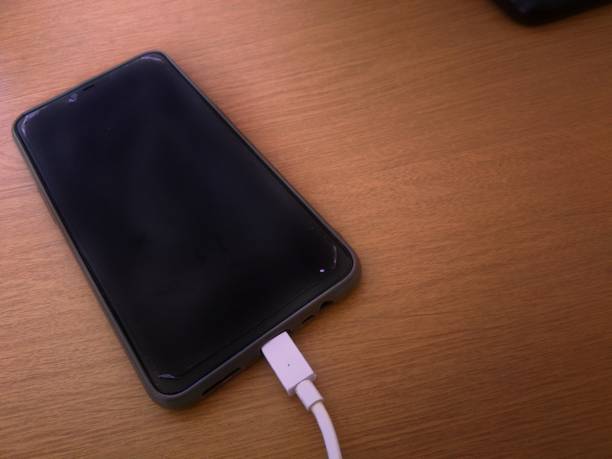 istock Close up the phone is currently charging 1262169845