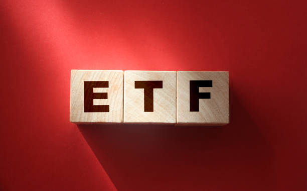ETF, Exchange Traded Fund, on wooden blocks. Financial concept ETF, Exchange Traded Fund, realtime mutual index fund that can trade in equity stock market, cube wooden block with alphabet building the word ETF. Financial concept exchange traded fund stock pictures, royalty-free photos & images