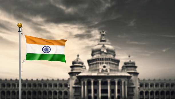 india waving flag  at vidhana soudha - bangalore india parliament building vidhana soudha imagens e fotografias de stock